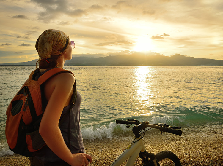 Young Traveller admiring the sunrise
