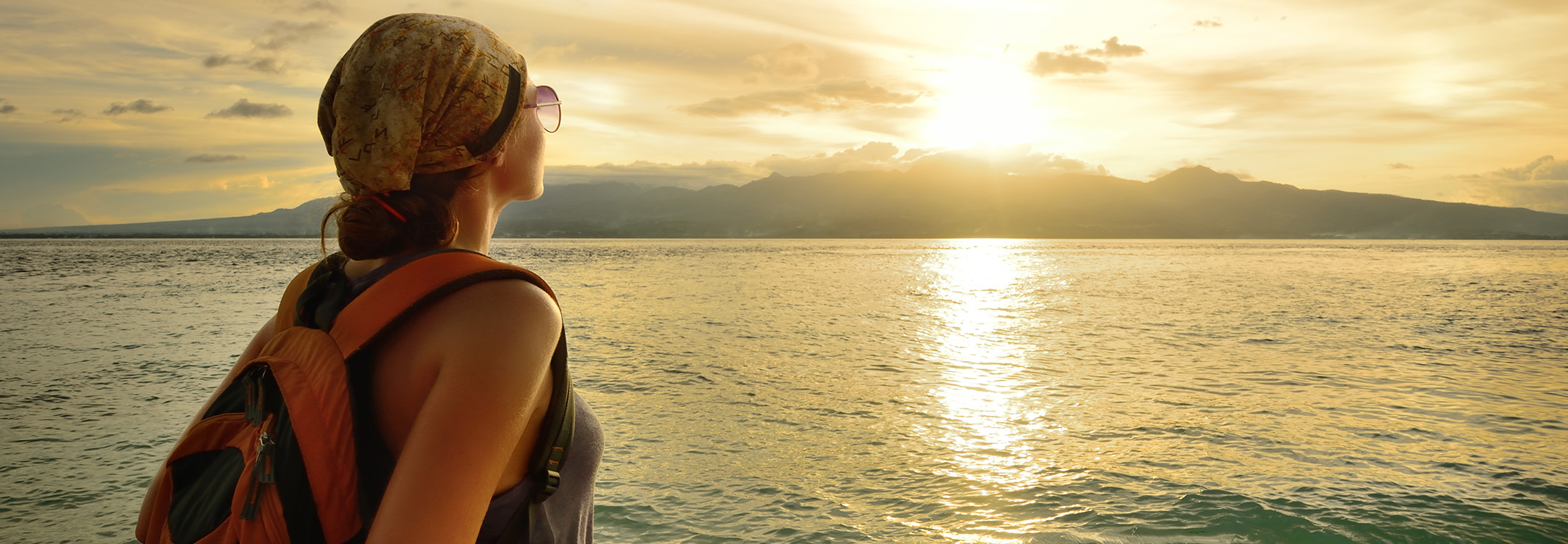 Young Traveller admiring the sunrise
