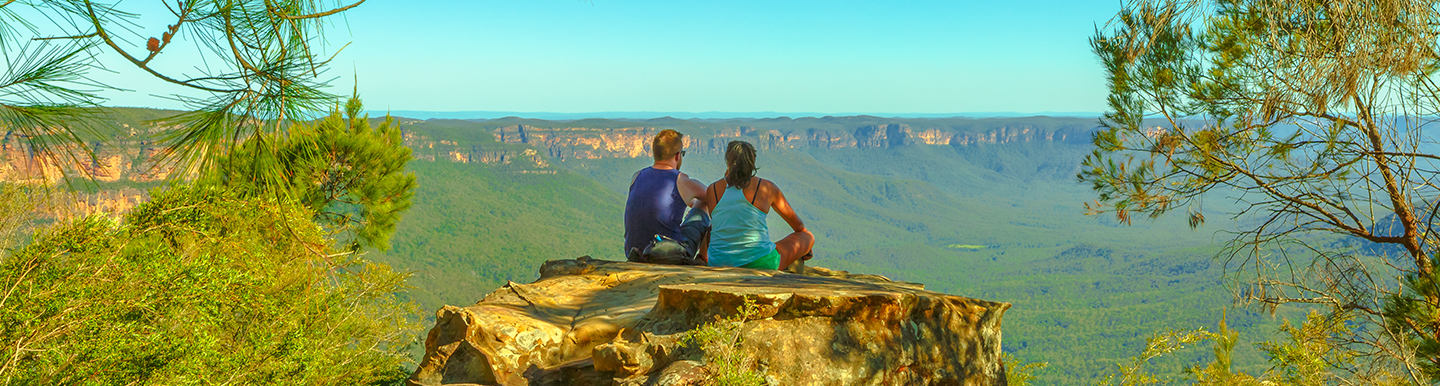 Couple looking at panoramic views of Blue Mountains