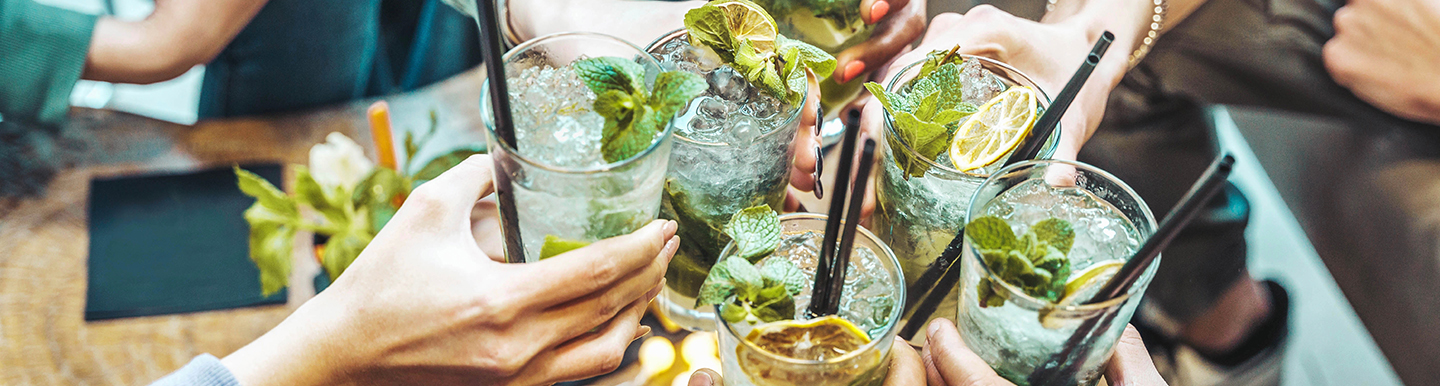 cheering with mojito drinks