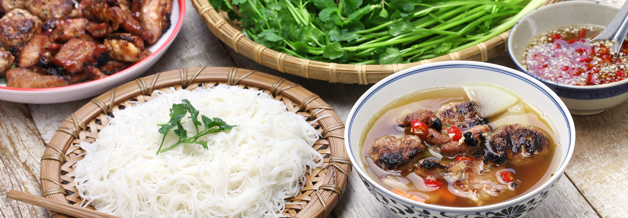 Bun Cha, with grilled pork, rice noodles and herbs
