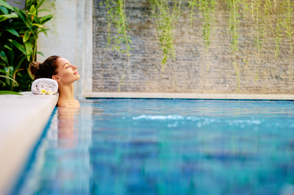woman relaxing in an outdoor spa pool