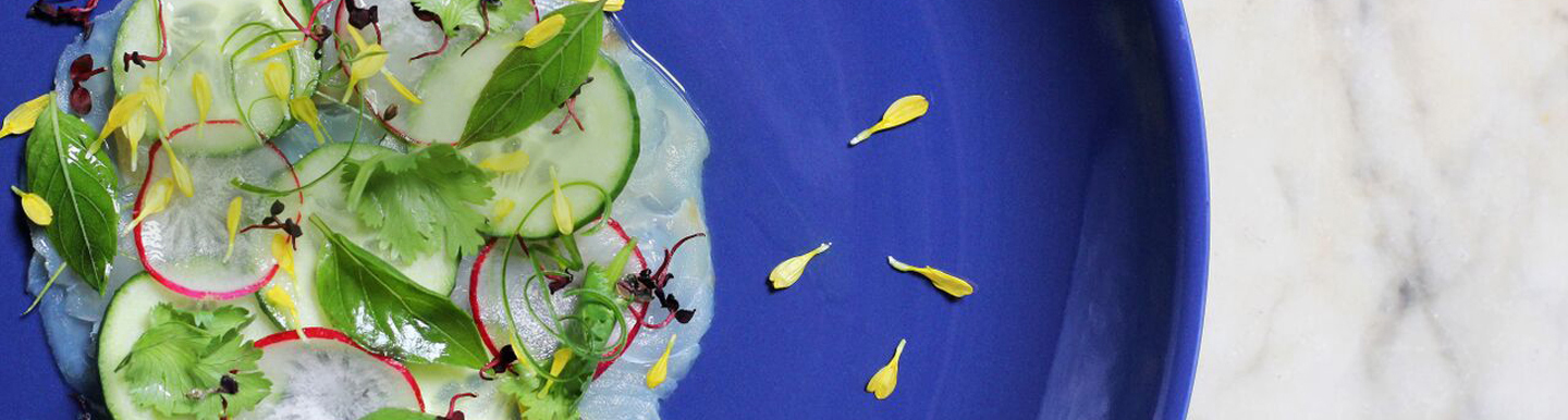 : hamachi sashimi on blue plate