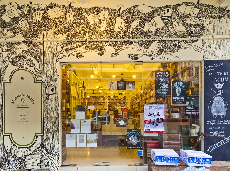 whimsically decorated exterior wall of books actually