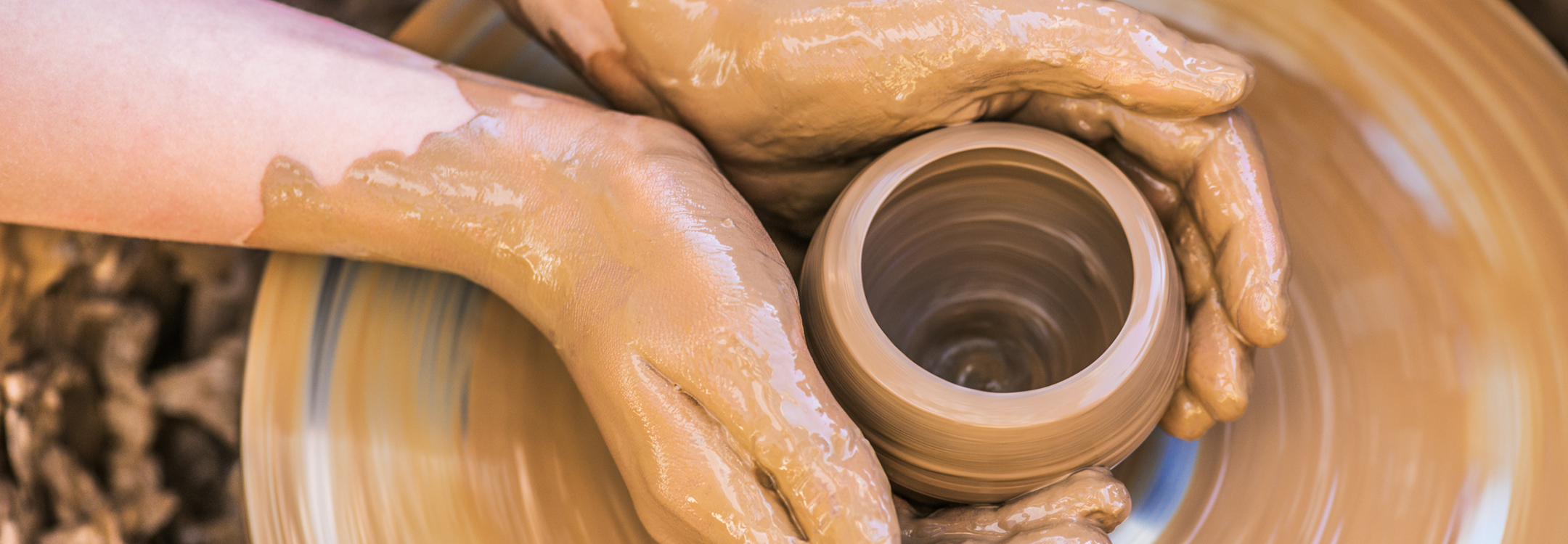 hands and potters wheel