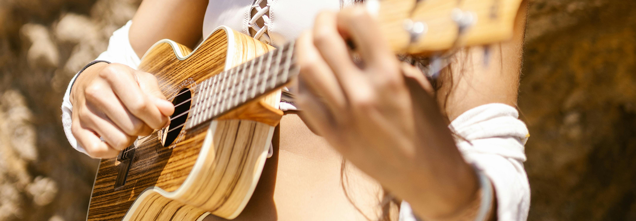 Ukulele by the beach | Photo by RDNE Stock in Pexels
