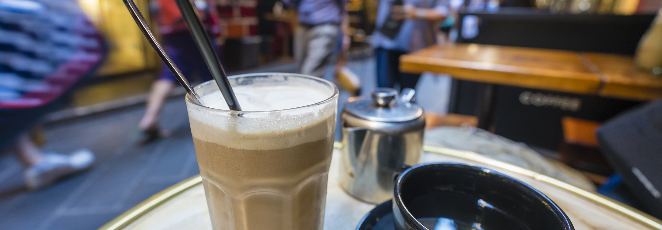enjoying coffee in a laneway