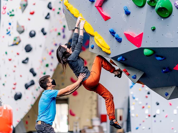 A young couple getting started on rock climbing