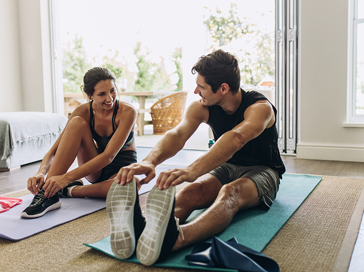 couple exercising together indoors 