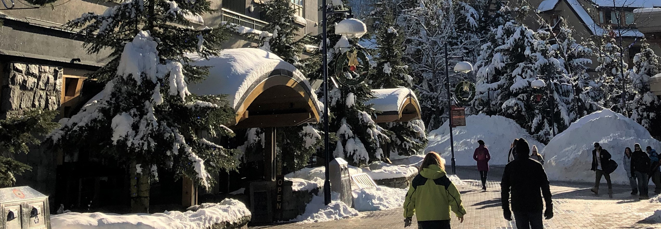 Skiers at Whistler village in the winter
