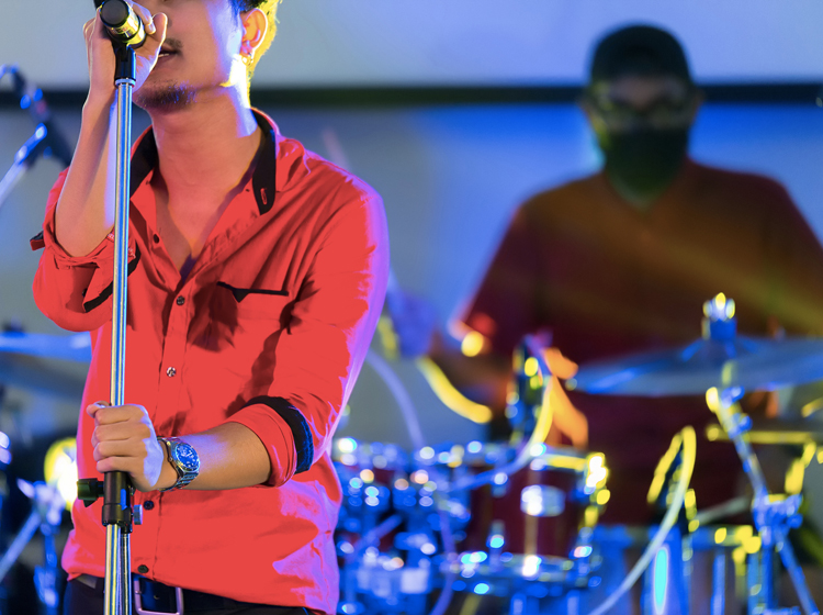 singer performing with band