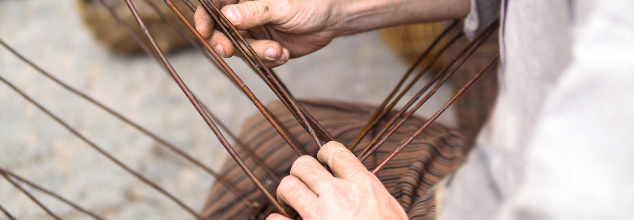 Close up of man doing basket weaving